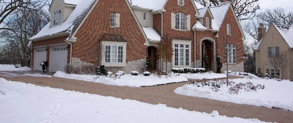 House in Ada, MI, with walkways cleared of snow.