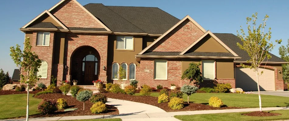 Landscaping with shrubs and plants in a front yard in Byron Center, MI.