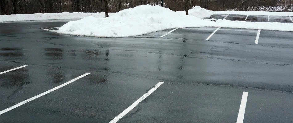 Snow pushed to side of parking lot in Ada, MI.