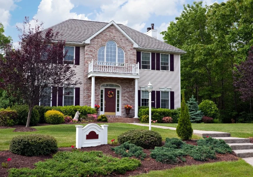 Beautiful brick-front house with landscaped garden in Ada, MI.